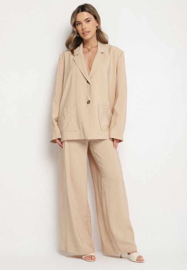 Born2be - Beżowe Spodnie z Modalu o Szerokim Kroju z Niskim Stanem Reavela. Okazja: na co dzień. Stan: obniżony. Kolor: beżowy. Styl: elegancki, casual, klasyczny