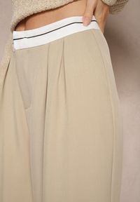 Renee - Beżowe Spodnie z Wiskozy Palazzo High Waist Zapinane na Suwak Nellieva. Okazja: na co dzień. Stan: podwyższony. Kolor: beżowy. Materiał: wiskoza. Styl: casual #3