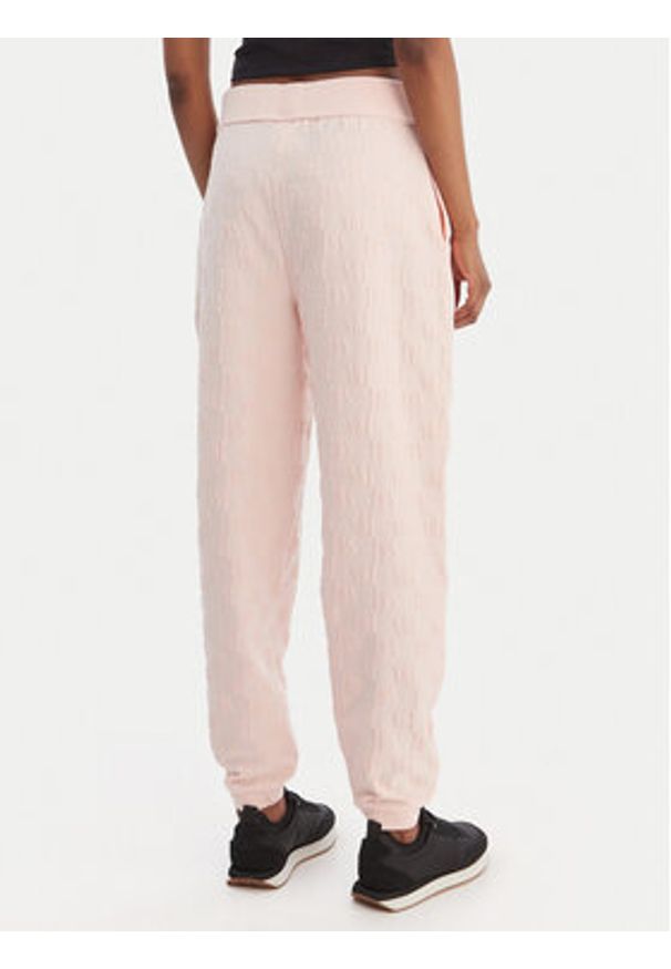 Hugo - HUGO Spodnie dresowe Monogram 50556809 Różowy Regular Fit. Kolor: różowy. Materiał: bawełna