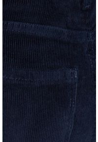 TOMMY HILFIGER - Tommy Hilfiger spodnie sztruksowe damskie kolor granatowy dopasowane medium waist. Kolor: niebieski. Materiał: sztruks