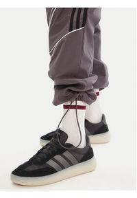 Adidas - adidas Spodnie dresowe Teamgeist adicolor JW5870 Szary Loose Fit. Kolor: szary. Materiał: syntetyk