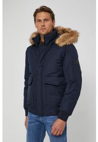 TOMMY HILFIGER - Tommy Hilfiger Kurtka puchowa męska kolor granatowy zimowa. Kolor: niebieski. Materiał: puch. Sezon: zima #1