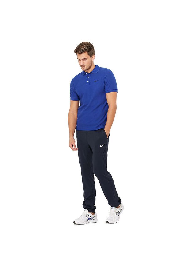Spodnie Dresowe Sportowe Męskie Nike Bawełniane Regular. Kolor: niebieski. Materiał: dresówka, bawełna. Sport: fitness