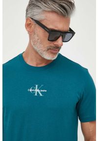 Calvin Klein Jeans t-shirt bawełniany kolor turkusowy z nadrukiem. Kolor: turkusowy. Materiał: bawełna. Wzór: nadruk. Styl: klasyczny