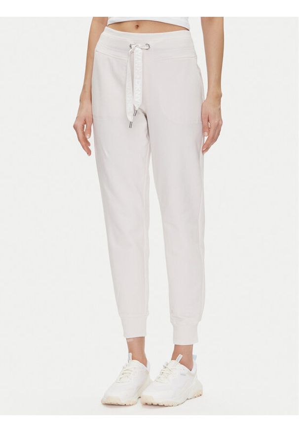 DKNY Sport Spodnie dresowe DP5P3496 Beżowy Regular Fit. Kolor: beżowy. Materiał: bawełna