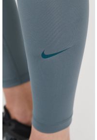 Nike Legginsy damskie kolor zielony gładkie. Stan: podwyższony. Kolor: zielony. Materiał: tkanina, włókno, dzianina, skóra. Technologia: Dri-Fit (Nike). Wzór: gładki #3