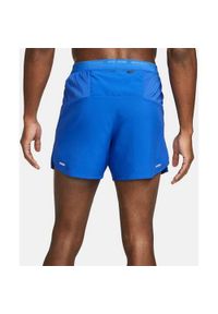 Spodnie treningowe męskie Nike Drifit Stride. Kolor: niebieski. Długość: krótkie. Sport: fitness