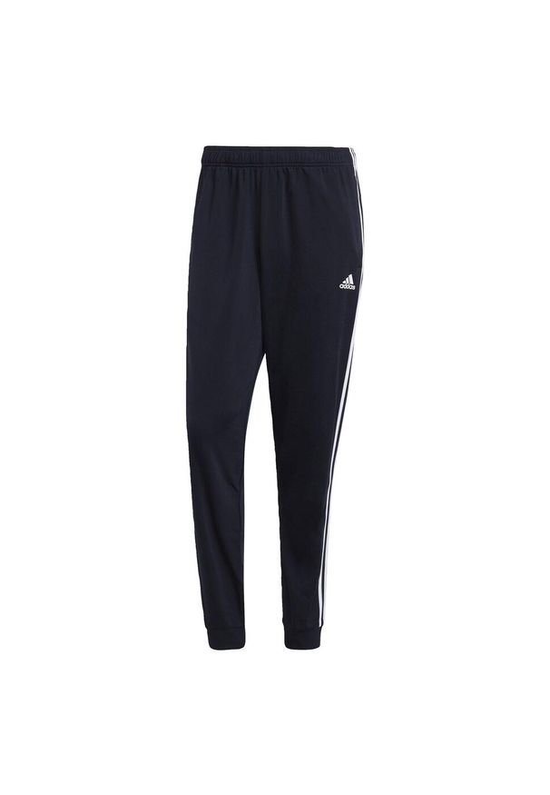 Adidas - Primegreen Essentials Warm-Up Tapered 3-Stripes Track Pants. Kolor: czarny, biały, niebieski, wielokolorowy. Materiał: poliester, dresówka, materiał. Sport: fitness