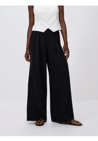 Reserved - Szerokie spodnie - czarny. Kolor: czarny. Materiał: tkanina. Wzór: gładki