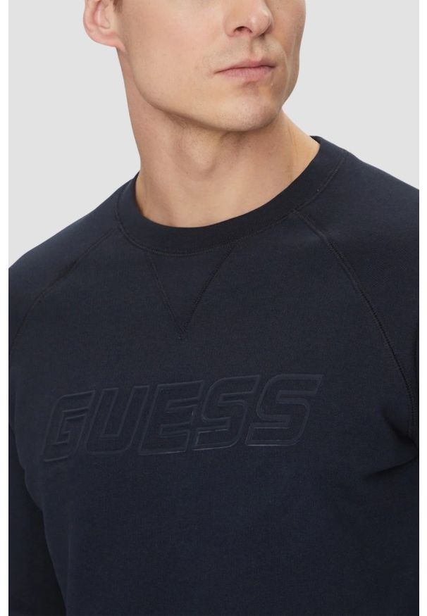 Guess - GUESS Granatowa męska bluza New Aldwin, Rozmiar L. Kolor: niebieski. Materiał: materiał, poliester, bawełna. Wzór: bez wzorów