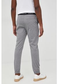 Calvin Klein Jeans spodnie dresowe męskie kolor szary gładkie. Kolor: szary. Materiał: dresówka. Wzór: gładki #4