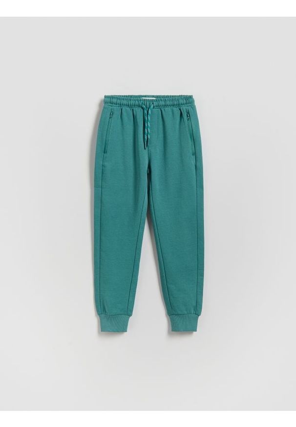 Reserved - Bawełniane joggery - morski. Kolor: morski. Materiał: bawełna