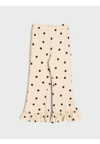 Sinsay - Spodnie flare w kropki z ozdobnymi falbankami - kremowy. Kolor: kremowy. Wzór: kropki #1