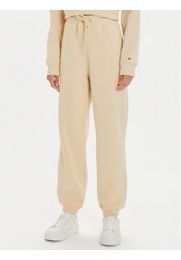 TOMMY HILFIGER - Tommy Hilfiger Spodnie dresowe Varsity WW0WW42884 Beżowy Regular Fit. Kolor: beżowy. Materiał: syntetyk, bawełna #1