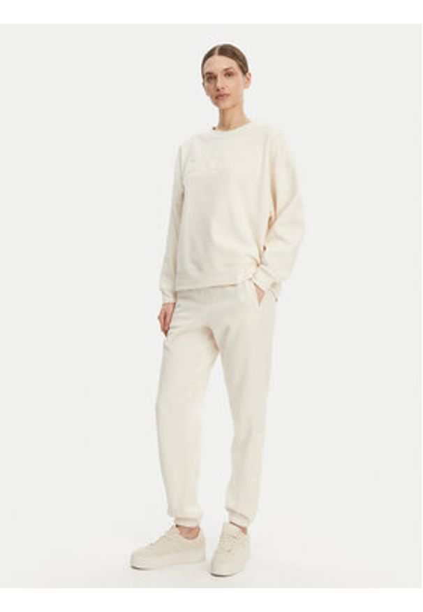 DKNY Sport Spodnie dresowe DP5P3585 Beżowy Regular Fit. Kolor: beżowy. Materiał: bawełna, syntetyk