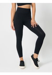 Sinsay - Legginsy sportowe - czarny. Kolor: czarny. Styl: sportowy
