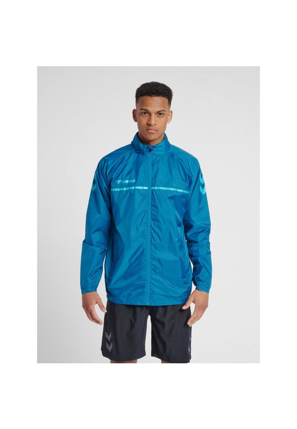 Kurtka Hummel hmlAUTHENTIC Pro. Kolor: turkusowy, niebieski, wielokolorowy. Materiał: materiał. Sezon: zima, jesień. Sport: fitness, piłka ręczna