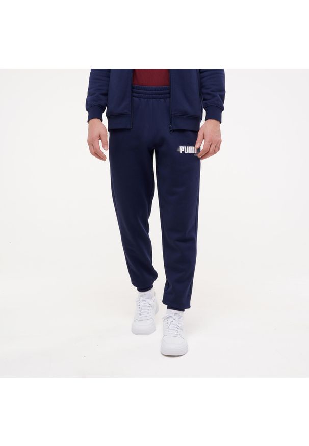 Spodnie dresowe męskie Puma Gym & Pilates. Kolor: niebieski. Materiał: dresówka. Sport: joga i pilates