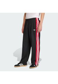 Adidas - adidas Spodnie dresowe KE0117 Czarny Loose Fit. Kolor: czarny. Materiał: syntetyk #1