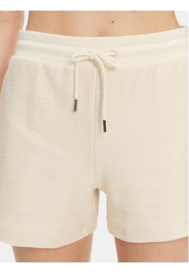 Puma Szorty sportowe Ess 629782 Beżowy Regular Fit. Kolor: beżowy. Materiał: bawełna