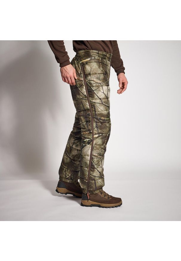 SOLOGNAC - Spodnie zimowe myśliwskie Solognac camo treemetic. Kolor: zielony, brązowy, wielokolorowy. Materiał: materiał. Sezon: zima. Sport: outdoor