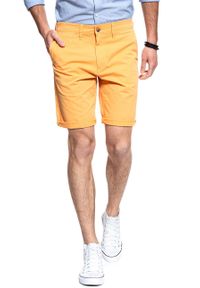 Wrangler - SPODENKI MĘSKIE WRANGLER CHINO SHORT AMBER YELLOW W14AMM15V 112126567. Materiał: materiał. Wzór: jednolity, aplikacja