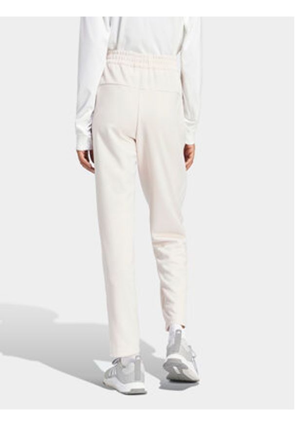 Adidas - adidas Spodnie dresowe Train Essentials IS3969 Różowy Loose Fit. Kolor: różowy. Materiał: syntetyk