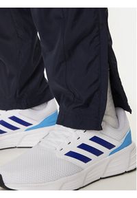 Adidas - adidas Spodnie dresowe House of Tiro IW3582 Granatowy Regular Fit. Kolor: niebieski. Materiał: syntetyk