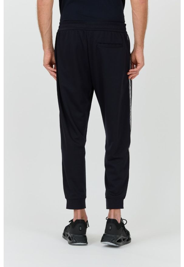 Armani Exchange - ARMANI EXCHANGE Granatowe męskie spodnie dresowe, Rozmiar L. Kolor: niebieski. Materiał: dresówka