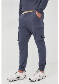 G-Star RAW - G-Star Raw spodnie dresowe męskie kolor granatowy gładkie. Kolor: niebieski. Materiał: dresówka. Wzór: gładki