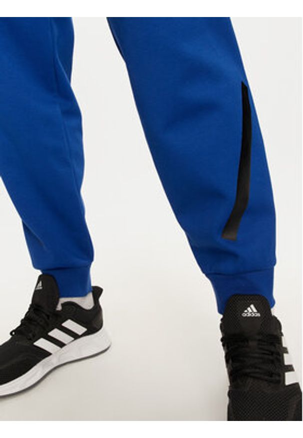 Adidas - adidas Spodnie dresowe Z.N.E. JF6541 Niebieski Regular Fit. Kolor: niebieski. Materiał: bawełna