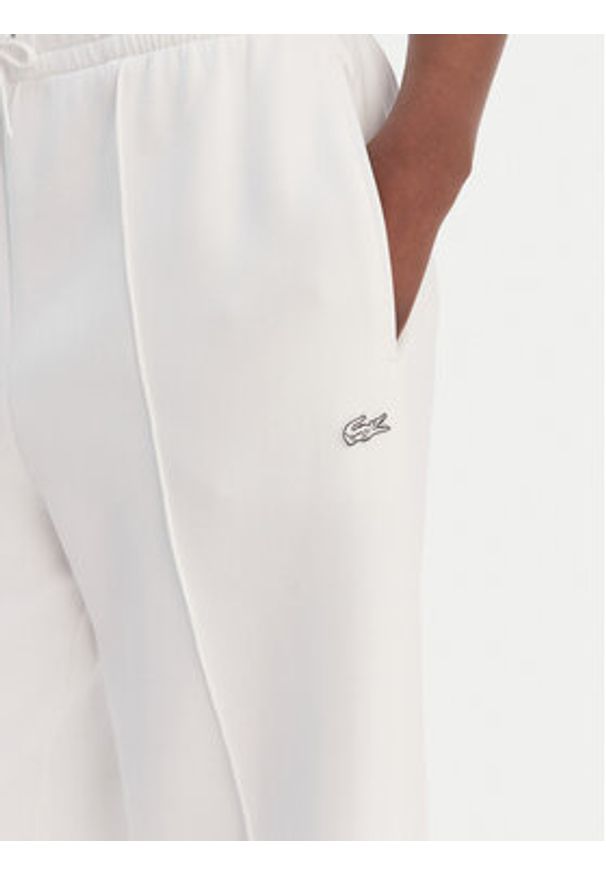 Lacoste Spodnie dresowe XF0041 Biały Relaxed Fit. Kolor: biały. Materiał: bawełna