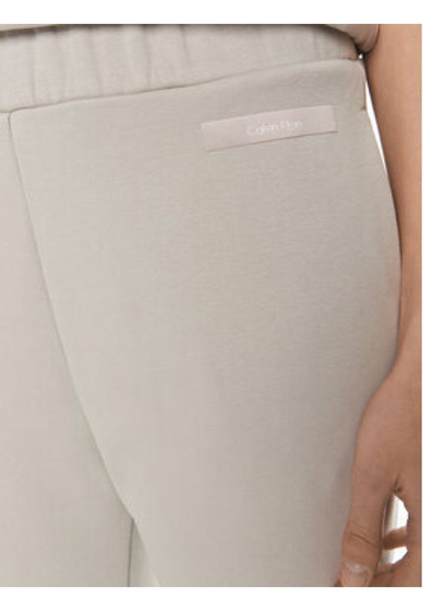 Calvin Klein Spodnie dresowe Micro Logo K20K206632 Beżowy Regular Fit. Kolor: beżowy. Materiał: bawełna
