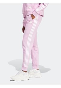 Adidas - Spodnie dresowe adidas. Kolor: różowy. Materiał: dresówka