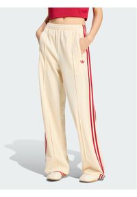 Adidas - adidas Spodnie dresowe 159027 Żółty Loose Fit. Kolor: żółty. Materiał: dresówka #1
