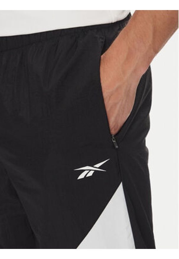 Reebok Spodnie dresowe 100223963 Czarny Regular Fit. Kolor: czarny. Materiał: syntetyk