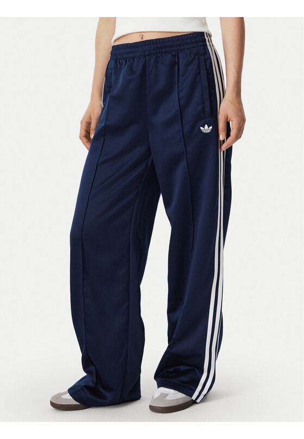 Adidas - adidas Spodnie dresowe Satin Sst Loose Trackpant KS7339 Granatowy Relaxed Fit. Kolor: niebieski. Materiał: syntetyk