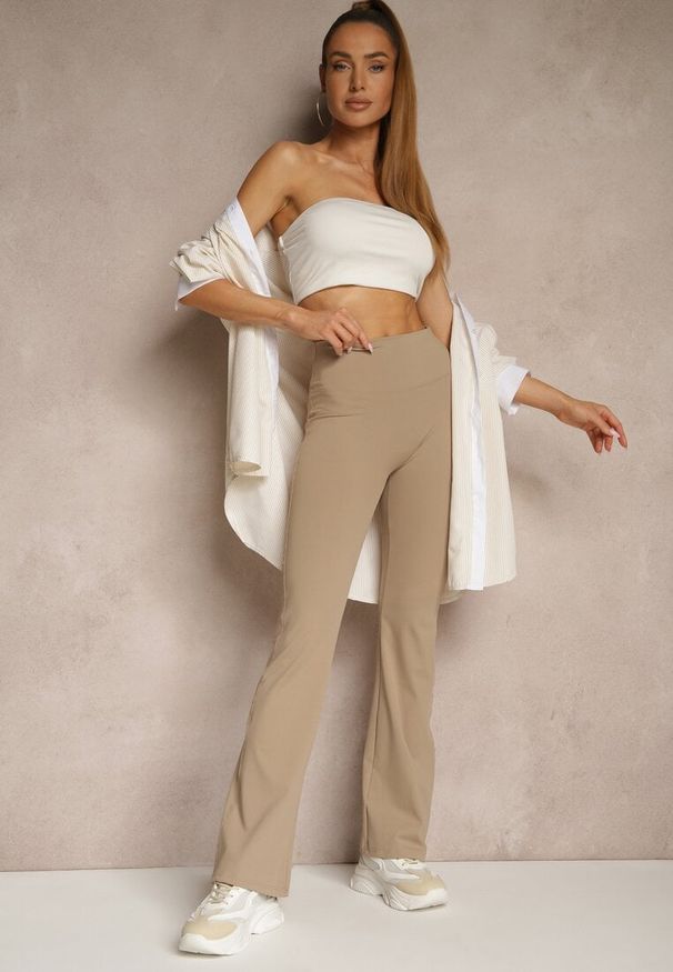 Renee - Beżowe Legginsy Dzwony High Waist Orruvana. Stan: podwyższony. Kolor: beżowy. Materiał: tkanina