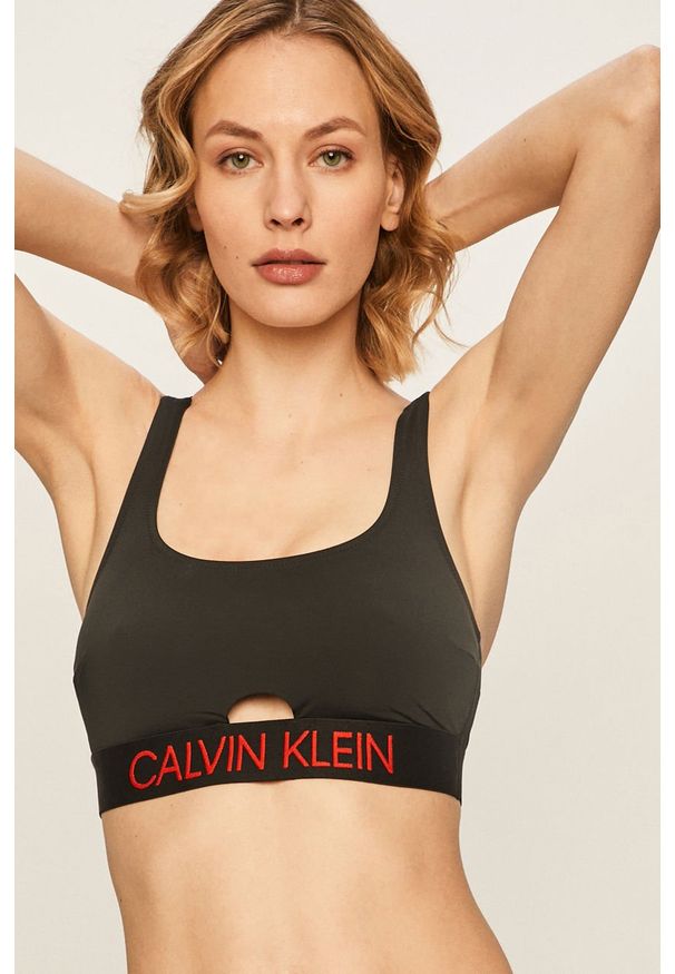 Calvin Klein - Biustonosz kąpielowy. Kolor: czarny. Materiał: materiał, poliamid, elastan, nylon, poliester. Wzór: aplikacja