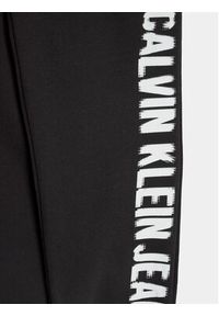 Calvin Klein Jeans Spodnie dresowe Pixel Logo IB0IB01935 Czarny Relaxed Fit. Kolor: czarny. Materiał: bawełna