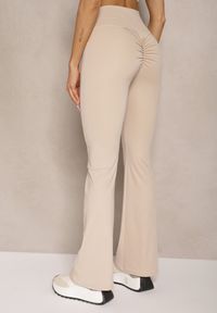 Renee - Jasnobeżowe Legginsy Dzwony High Waist Orruvana. Stan: podwyższony. Kolor: beżowy. Materiał: tkanina