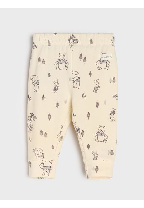 Sinsay - Spodnie z polarem w środku Winnie the Pooh - kremowy. Kolor: kremowy. Materiał: polar