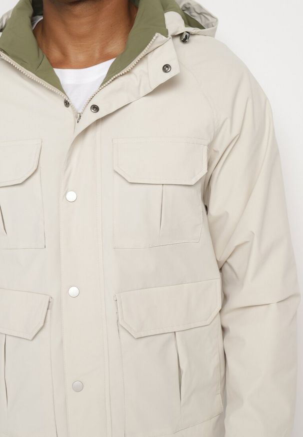 Born2be - Jasnobeżowa Kurtka Wiatrówka Pikowana z Ociepleniem i Odpinanym Kapturem Bralinae. Okazja: na co dzień. Kolor: beżowy. Styl: casual