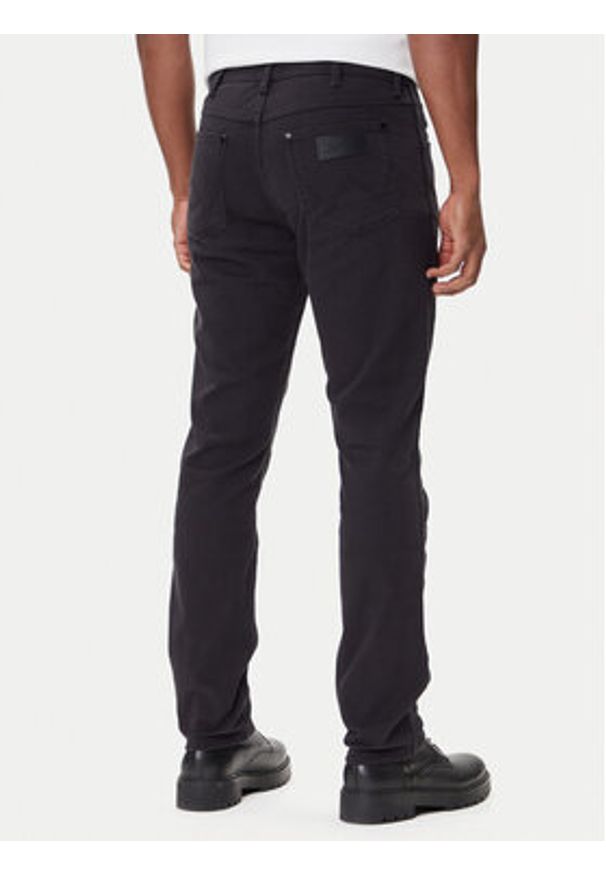 Wrangler Jeansy Larston 112371641 Czarny Tapered Fit. Kolor: czarny