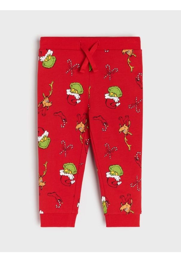 Sinsay - Spodnie jogger ze wzorem Grinch - czerwony. Kolor: czerwony