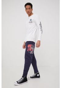 Tommy Jeans spodnie dresowe bawełniane DM0DM12949.PPYY męskie kolor granatowy z nadrukiem. Kolor: niebieski. Materiał: bawełna, dresówka. Wzór: nadruk #4