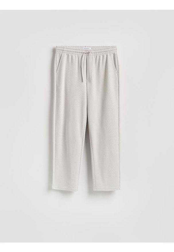 Reserved - Spodnie z wiązaniem - jasnoszary. Kolor: szary. Materiał: dzianina, bawełna