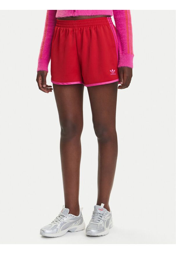 Adidas - adidas Szorty sportowe adicolor 3-Stripes Sprinter JZ3513 Czerwony Loose Fit. Kolor: czerwony. Materiał: syntetyk