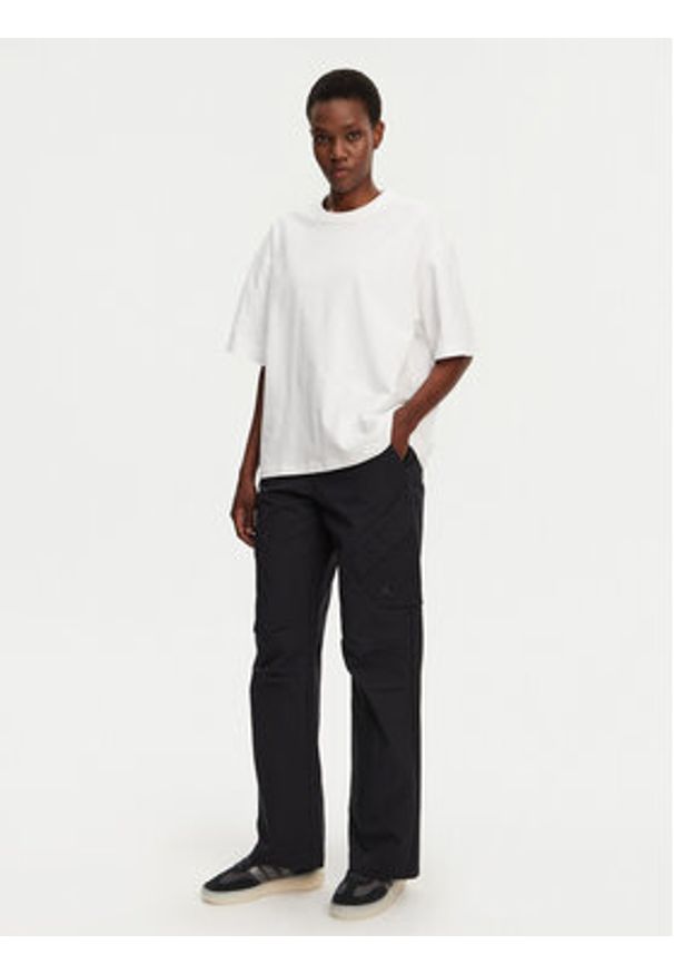 Nike Spodnie materiałowe FV7098 Czarny Regular Fit. Kolor: czarny. Materiał: bawełna