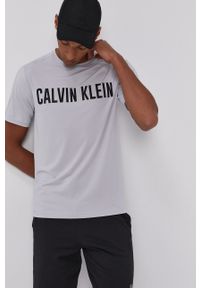 Calvin Klein Performance - T-shirt. Okazja: na co dzień. Kolor: szary. Materiał: skóra. Wzór: nadruk. Styl: casual